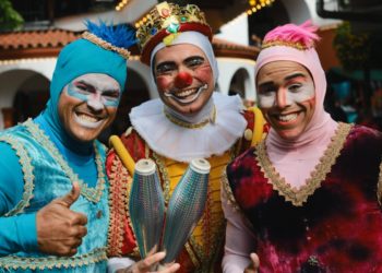 three jugglers with smiling faces