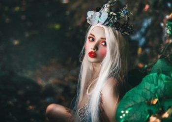 selective focus photography of woman wearing crown