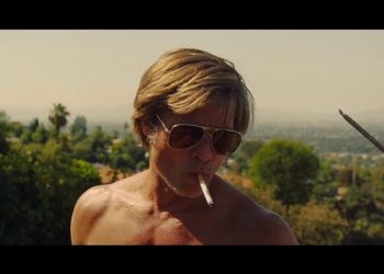 Brad Pitt climbs a roof ONCE UPON A TIME IN HOLLYWOOD