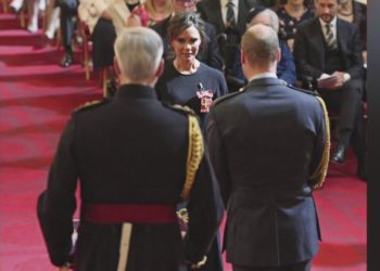 Victoria Beckham receives an OBE from Prince William for services to fashion