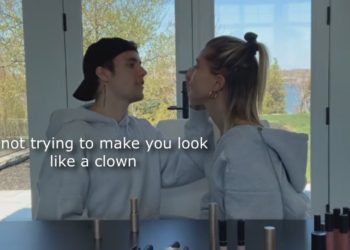 Justin Bieber doing his wife make up!