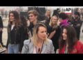 Tommy Hilfiger kneels before Lady Gaga at Venice Beach fashion show, Fergie performs